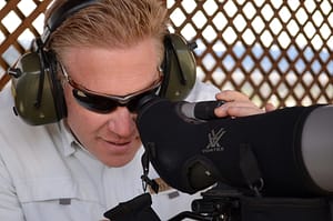 person using a spotting scope