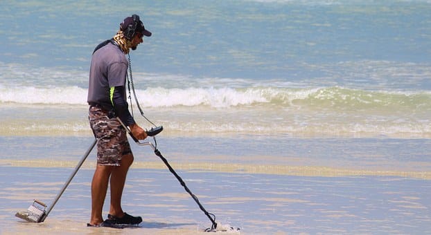 man using metal detector